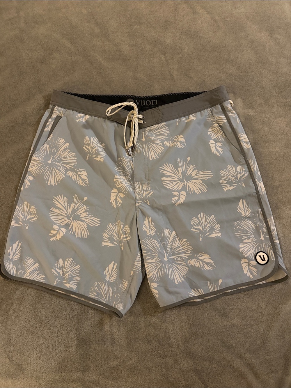Vuori Light Blue Hibiscus Swim Shorts